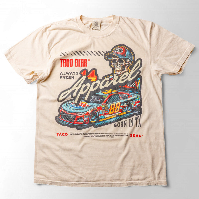 Taco Gear Always Fresh Racing t-shirt with vintage skull and racecar graphic, bold “Born in TX” text, and retro motorsport design on black and sand tees.