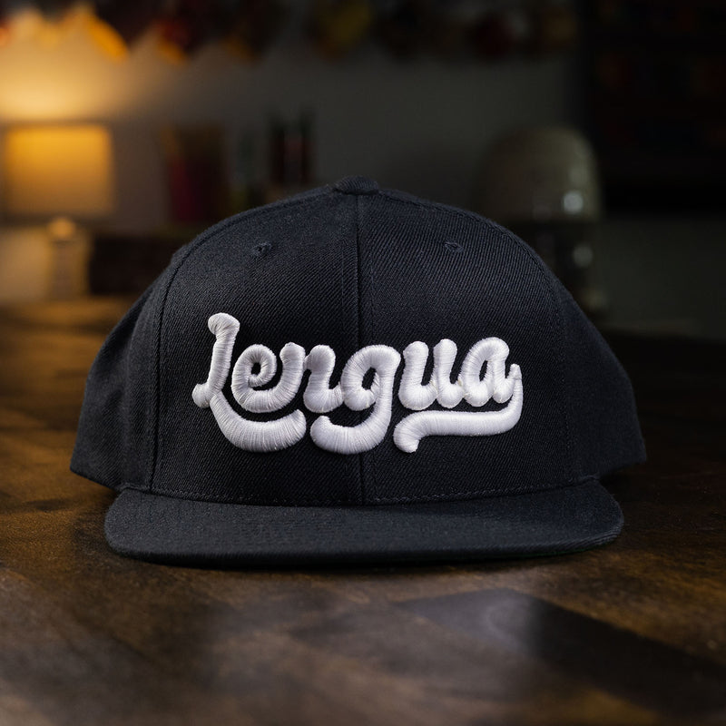 taco gear lengua snapback hat in black with white letters