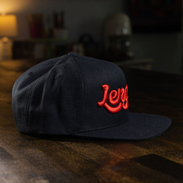taco gear lengua snapback hat in black with red letters