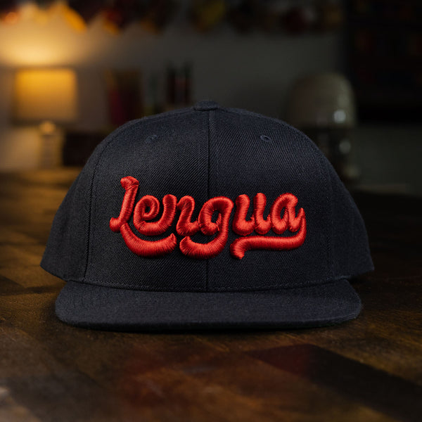 taco gear lengua snapback hat in black with red letters
